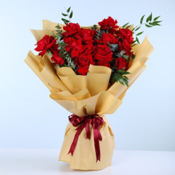 15 red rose bouquet wrapped in kraft paper with ribbon