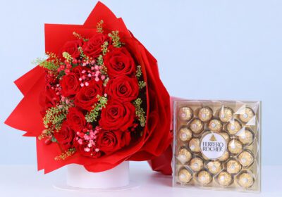 Red roses in red wrap, finished with a Ferrero Rocher chocolate box