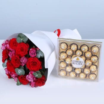A bouquet of red and pink roses, and eucalyptus in white wrapping style, finished with a ribbon, paired with a Ferrero Rocher chocolate gift box.