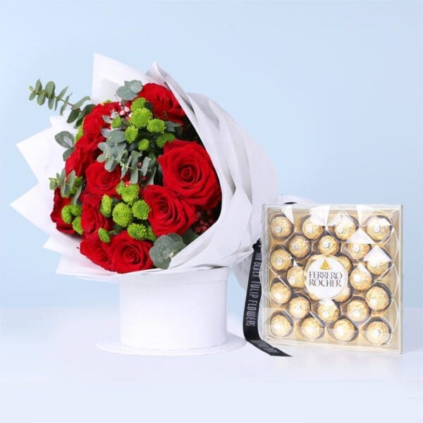 red-roses-ferrero-moments-combo Bouquet of red roses with green chrysanthemums and eucalyptus in white wrap, finished with a Ferrero Rocher box