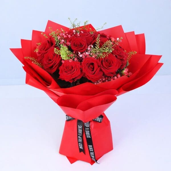 red-roses-warm-embrace-red-wrap Red roses with delicate fillers in an elegant red wrap