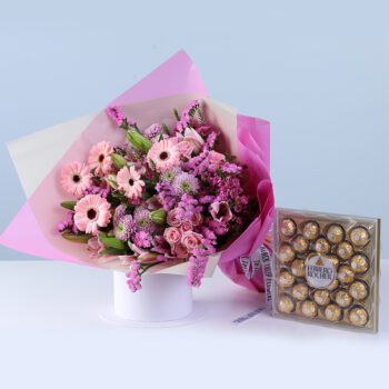 Blossom Celebration Bouquet Ferrero 24 Pcs featuring mixed flowers like gerberas, lilies, baby roses, and chrysanthemums with chocolates for gifting