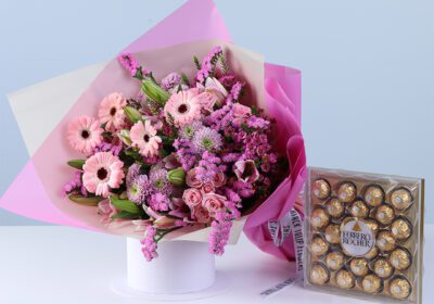 Blossom Celebration Bouquet Ferrero 24 Pcs featuring mixed flowers like gerberas, lilies, baby roses, and chrysanthemums with chocolates for gifting