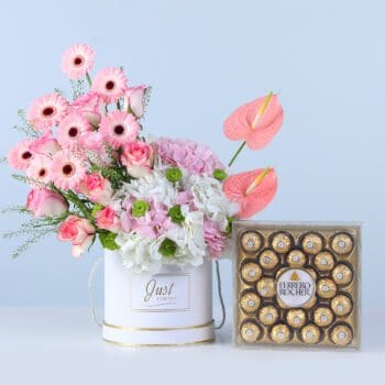 Blush Bloom Box Ferrero 24 pcs with pink gerberas, roses, hydrangeas, anthurium, and chocolates arranged in a white box for gifting