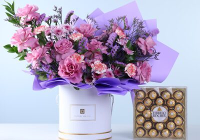 Classic Purple Arrangement Ferrero 24 Pcs Combo featuring purple roses, carnations, chrysanthemums, caspia, statice, and chocolates arranged for gifting