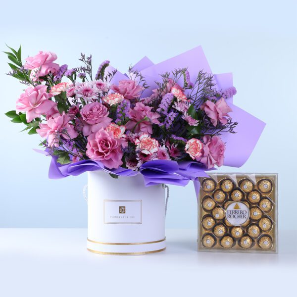 Classic Purple Arrangement Ferrero 24 Pcs Combo featuring purple roses, carnations, chrysanthemums, caspia, statice, and chocolates arranged for gifting