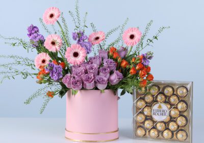 Enchanted Bloomshade Pink Box Ferrero 24 pcs featuring mixed pink, purple, and orange flowers arranged in a pink box with chocolates