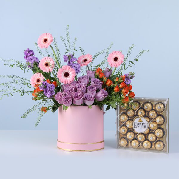 Enchanted Bloomshade Pink Box Ferrero 24 pcs featuring mixed pink, purple, and orange flowers arranged in a pink box with chocolates