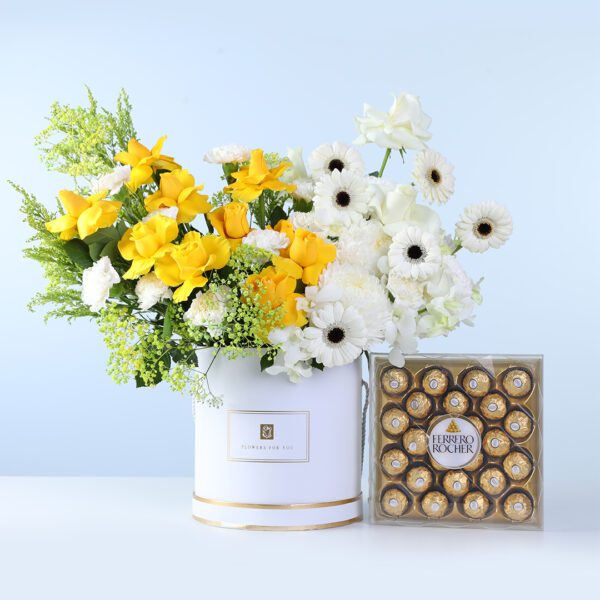 Golden White Bloom Arrangement Ferrero 24 Pcs featuring yellow roses, white roses, carnations, gerberas, orchids, and chocolates arranged in a floral box
