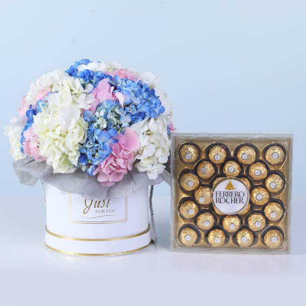 Hydrangea Bliss Gift Box with Ferrero featuring white, blue, and pink hydrangeas with chocolates arranged in a white box for gifting and décor
