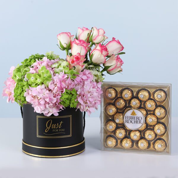 Modern Pastel Bloom Ferrero 24 Pcs featuring hydrangeas and pink roses arranged in a sleek black box with Ferrero chocolates for gifting