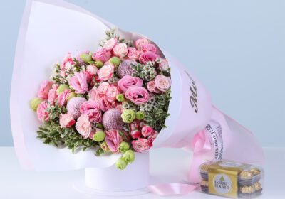 Mothers Day Pink Flower Gift Combo with lisianthus, baby roses, greenery, and Ferrero chocolates arranged beautifully for gifting