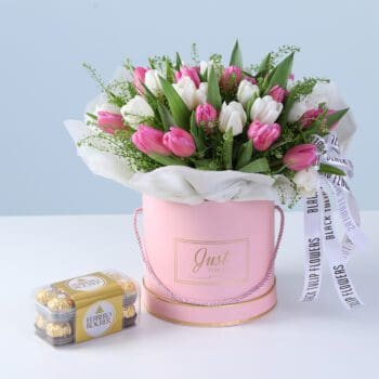 Pink and white tulips in a box with 16 Ferrero Rocher chocolates