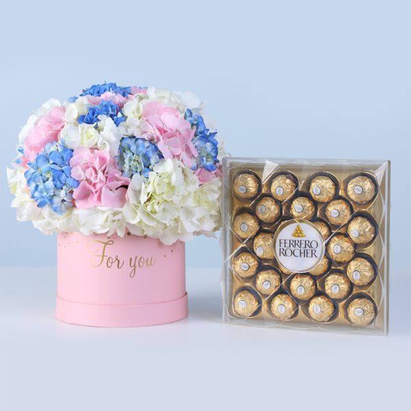 Pastel Hydrangea Bloom Box Ferrero 24 pcs featuring white, blue, and pink hydrangeas arranged in a pink box with chocolates for gifting