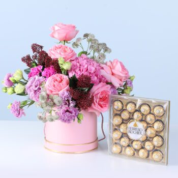 Pastel Pink Harmony Bouquet with Ferrero featuring pink gerberas, roses, lilies, hydrangea, and chocolates arranged in elegant wrapping for gifting