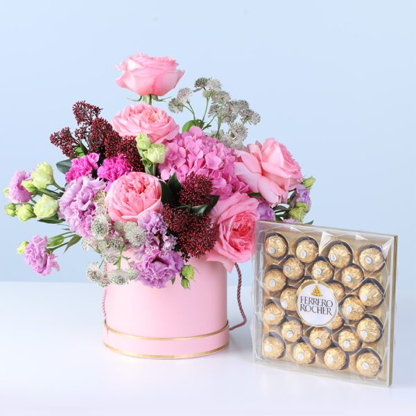 Pastel Pink Harmony Bouquet with Ferrero featuring pink gerberas, roses, lilies, hydrangea, and chocolates arranged in elegant wrapping for gifting