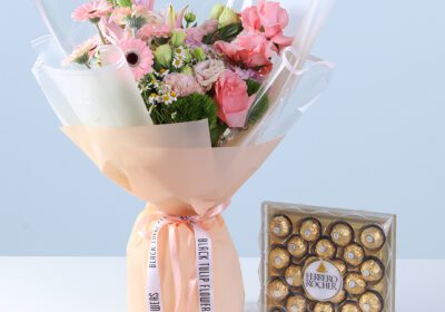Pastel Pink Harmony Bouquet with Ferrero featuring pink gerberas, roses, lilies, hydrangea, and 24 Ferrero chocolates arranged for gifting