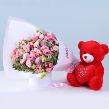 Pink Floral Combo for Mom with lisianthus, baby roses, greenery, and teddy arranged beautifully for gifting