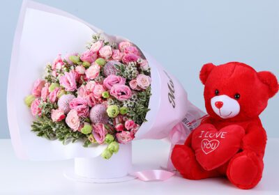 Pink Floral Combo for Mom with lisianthus, baby roses, greenery, and teddy arranged beautifully for gifting