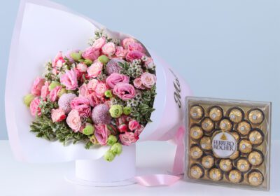 Pink Flowers Mother’s Day Combo with lisianthus, baby roses, greenery, and Ferrero chocolates arranged in a premium bouquet