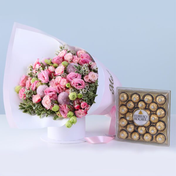 Pink Flowers Mother’s Day Combo with lisianthus, baby roses, greenery, and Ferrero chocolates arranged in a premium bouquet