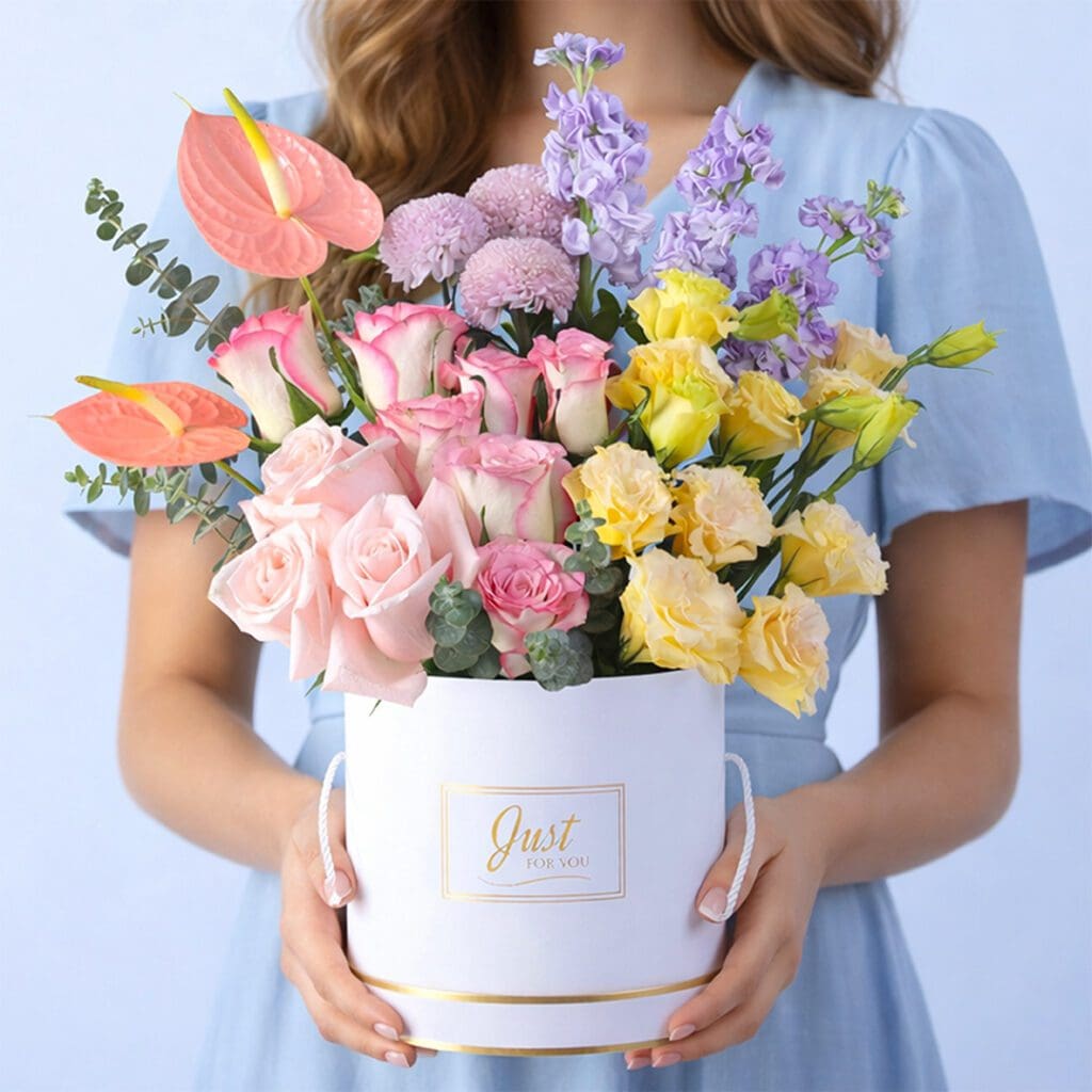 Luxury mixed flower box with matthiola anthurium roses lisianthus and eucalyptus in soft pastel tones