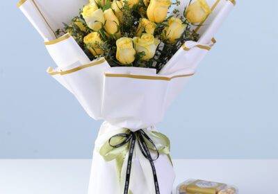 Premium Yellow Rose Ferrero Gift Combo with yellow roses, millet berry fillers, and Ferrero Rocher chocolates arranged for gifting