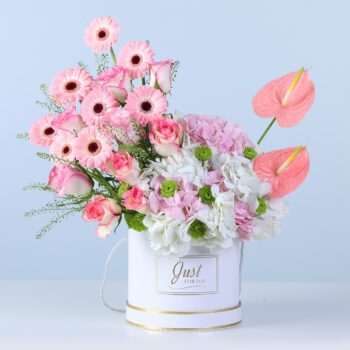 Elegant light-toned floral arrangement in a modern white box for gifting and decor