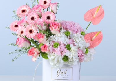 Elegant light-toned floral arrangement in a modern white box for gifting and decor