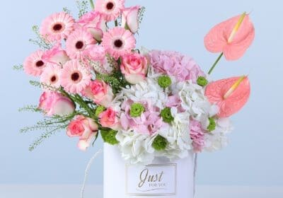 Elegant light-toned floral arrangement in a modern white box for gifting and decor