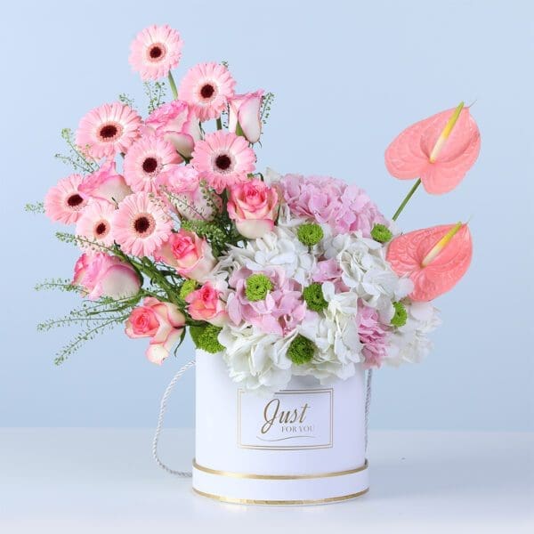serene-petal-harmony-box Elegant light-toned floral arrangement in a modern white box for gifting and decor