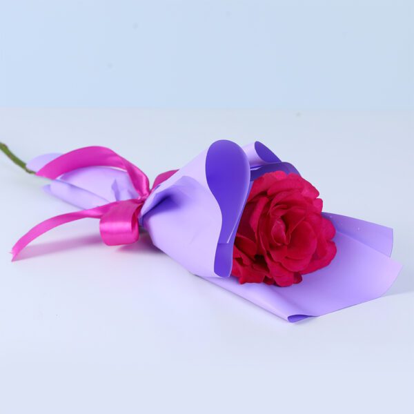 Single deep pink rose elegantly wrapped as a romantic and thoughtful flower gift