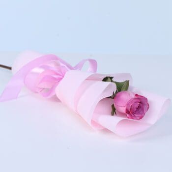 Single premium purple rose wrapped elegantly as a romantic flower gift