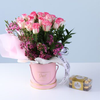 Soft Pink Rose Luxury Box with Ferrero featuring double pink roses, wax flowers, greenery, and chocolates arranged in a pink box for gifting