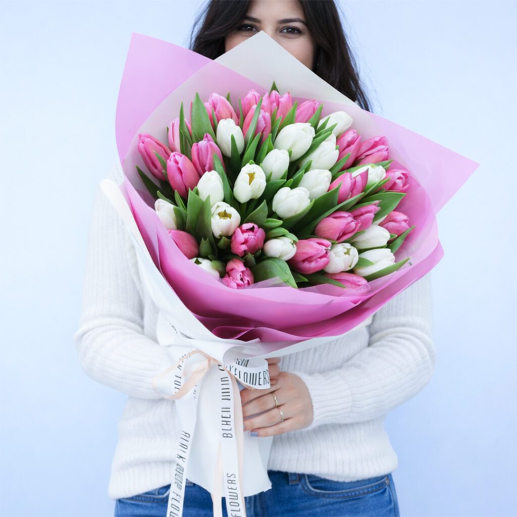 Elegant pink and white tulip hand bouquet wrapped beautifully for gifting