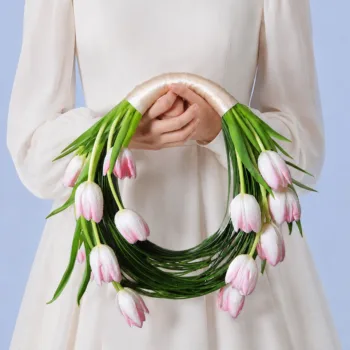 Blush Tulip Bridal Bouquet featuring 15 light pink tulips with steel grass accents arranged in a minimalist bridal design