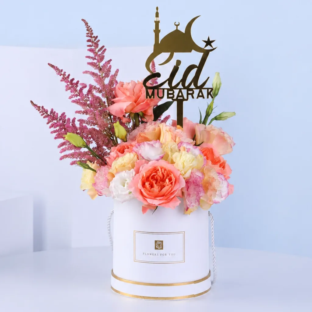 Elegant Eid Bloom Box featuring pink and peach roses with pink astilbe arranged in a white box with an Eid Mubarak topper for festive gifting
