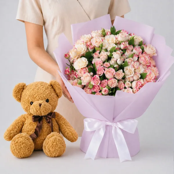 pink-roses-teddy-combo Pink Roses Teddy Combo featuring pink spray roses paired with a 70cm brown teddy bear for romantic gifting and special occasions