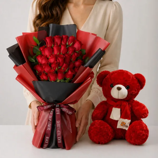 red-roses-teddy-combo Red Roses Teddy Combo featuring 25 red roses with ruscus greenery paired with a 50cm red teddy bear for romantic gifting