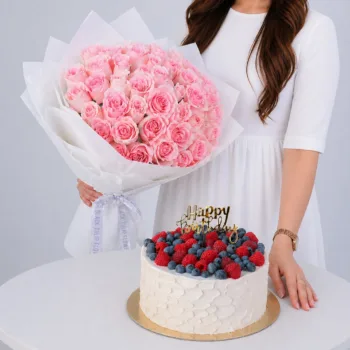 Titanic Roses Cake Combo featuring 40 light pink Titanic roses paired with a 1kg vanilla raspberry cake for celebrations and gifting