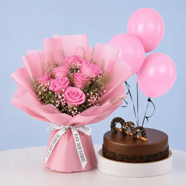 Blushing Rose Cake Combo featuring 7 pink roses, gypsophila, lepidium, 3 balloons, and a rich chocolate ganache cake for celebrations and gifting.
